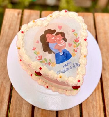 Mini torta Burncake decorada por el Día de la Madre, con centro sorpresa que revela fotos personalizadas.